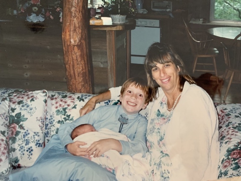 Mom with us as kids on the flowered couch